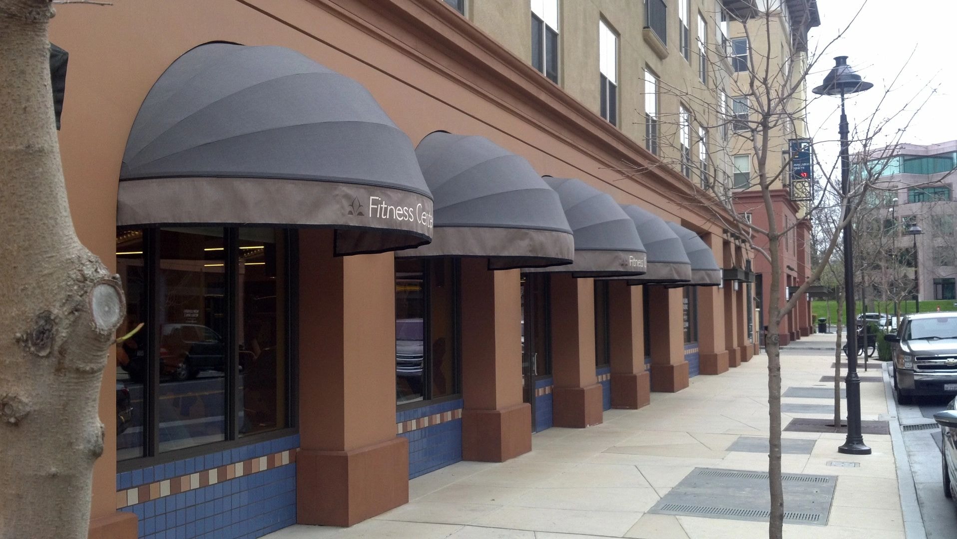 Commercial awning at fitness center storefront